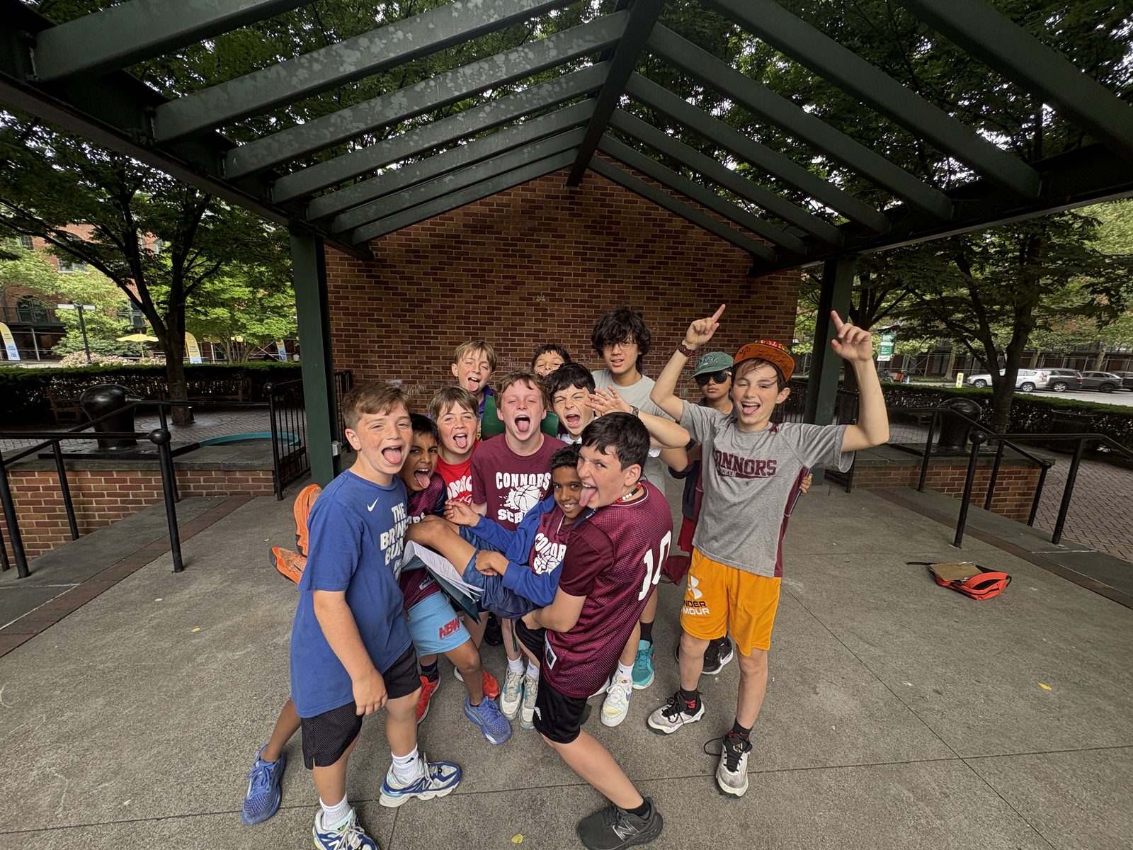 A group of fifth grade boys cheering during the Hoboken scavenger hunt